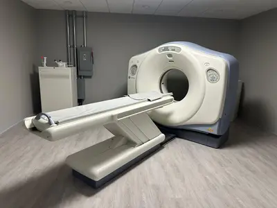 A CT scanner room with the equipment disconnect and branch panel mounted on the wall inside the door.